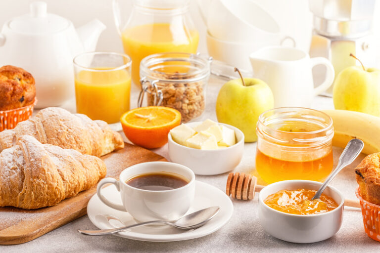 Continental breakfast with fresh croissants, orange juice and co